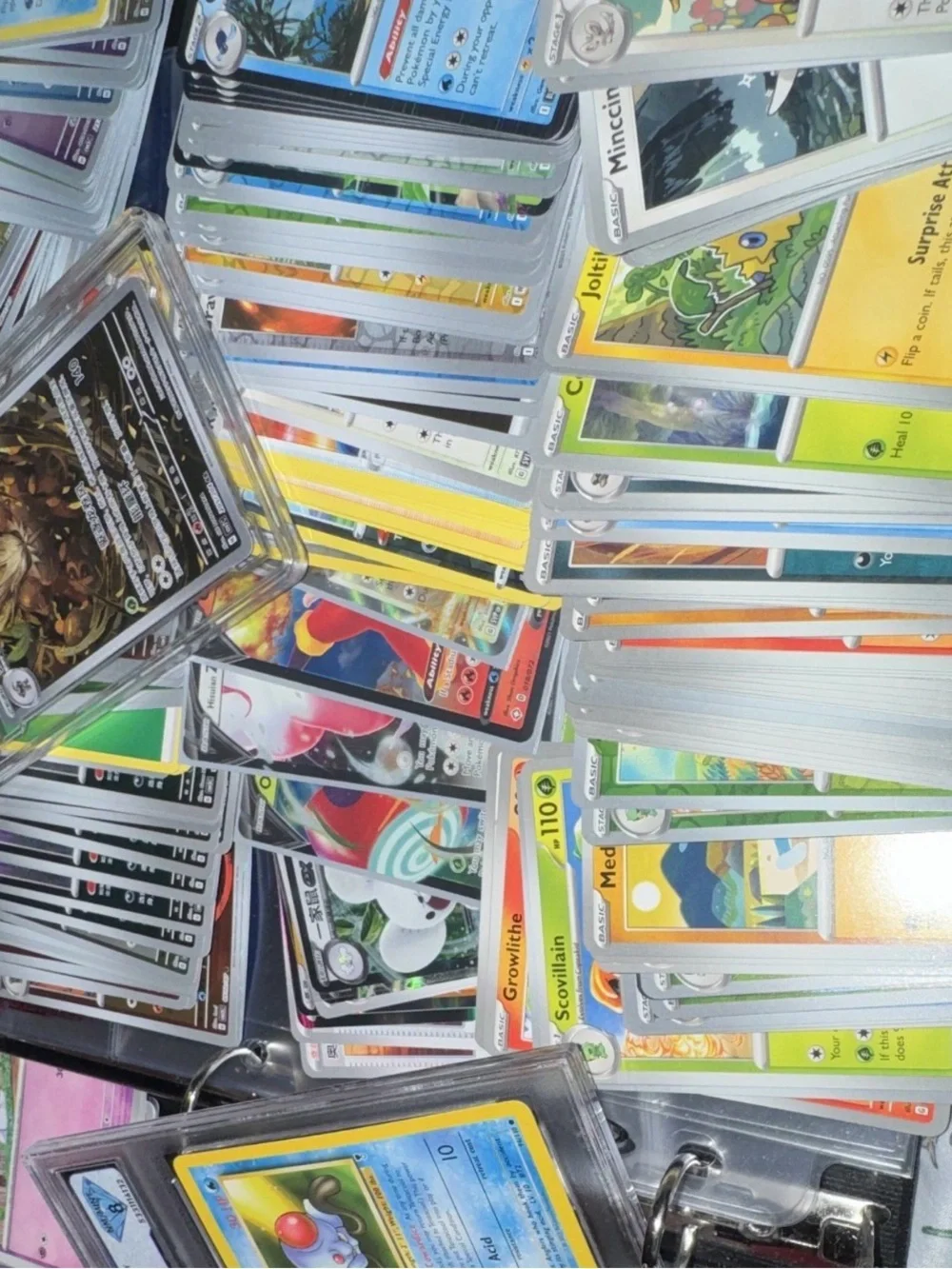 3 slabs and 500 bulk Assorted Pokemon including holo/ex. white flare black bolt